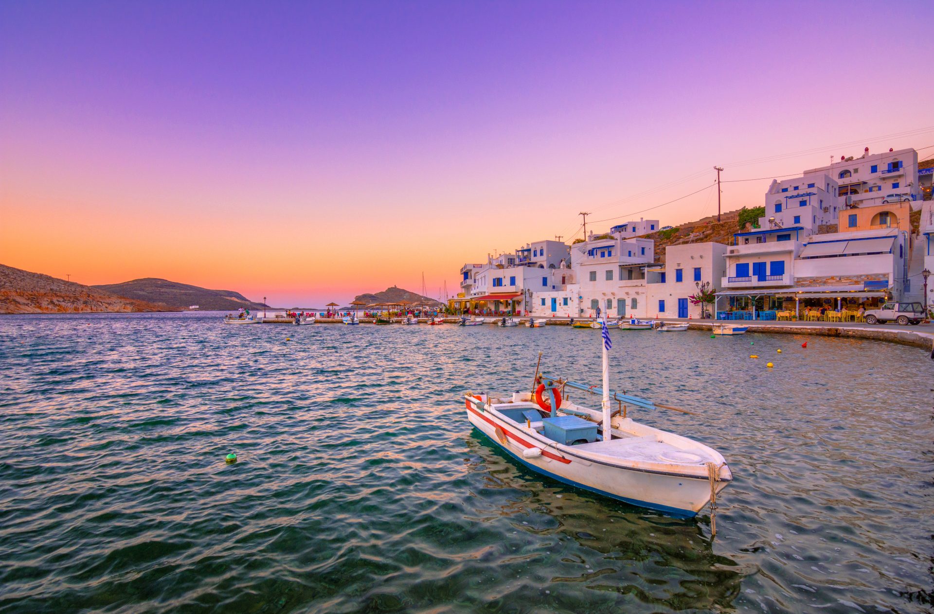 The small peaceful old harbor of picturesque Panormos at sunset, Tinos island,